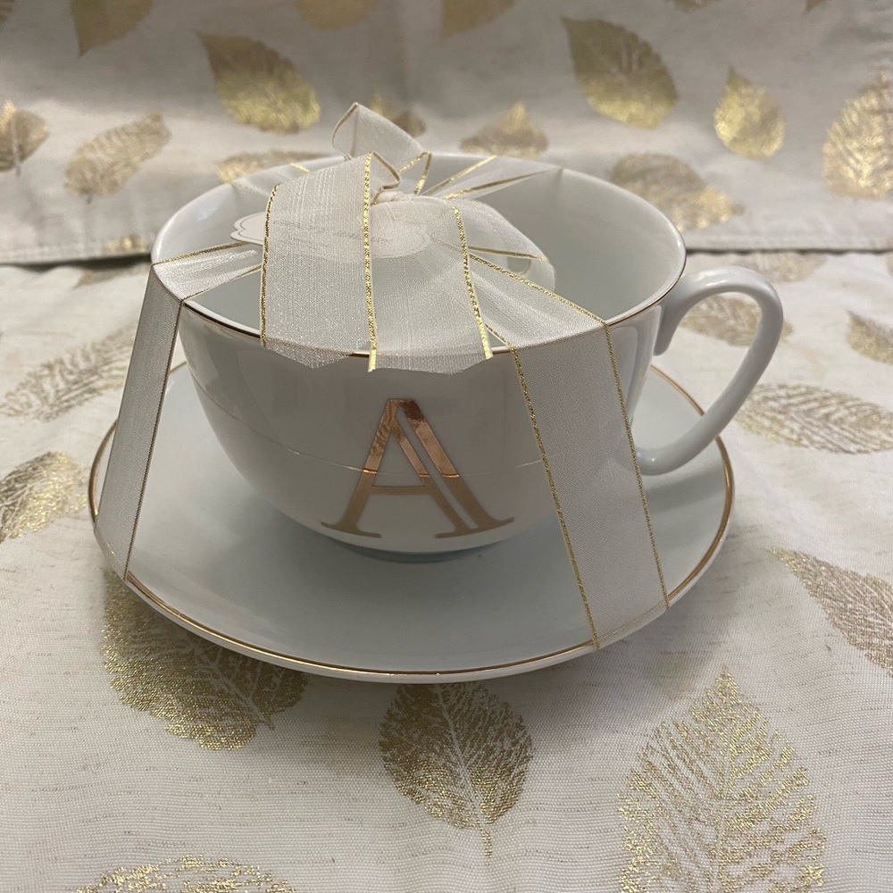 Cup n saucer with A initials.new not use